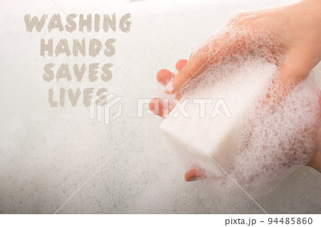 Child washing hands  in foam Stop COVID-19. 94485860