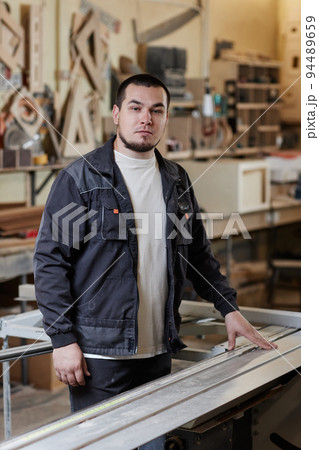Man Working At Furniture Factory Man Working At Furniture Factory 94489659