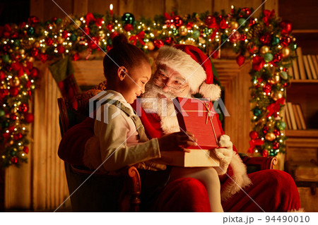Cute Little Girl With Santa On Christmas Cute Little Girl With Santa On Christmas 94490010