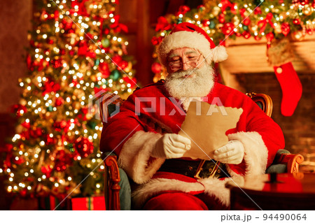 Santa Reading Letter On Christmas Santa Reading Letter On Christmas 94490064