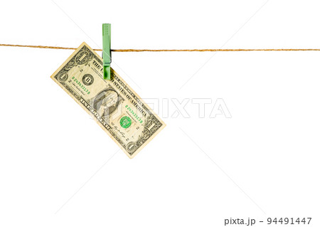 Money laundering. Dollar banknotes hanging on clothesline isolated on white background Money laundering. Dollar banknotes hanging on clothesline isolated on white background 94491447