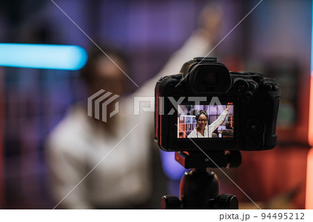 View of video camera screen with attractive confident african american skilled business woman 94495212