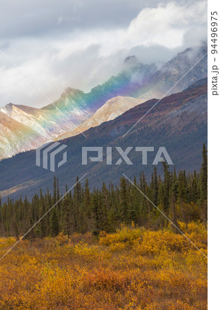 Rainbow in mountains 94496975