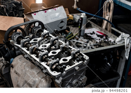 Disassembled car engine block at car service station Disassembled car engine block at car service station 94498201