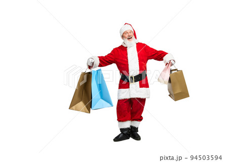 Portrait of senior man in image of Santa Claus with many shopping bags isolated over white background Portrait of senior man in image of Santa Claus with many shopping bags isolated over white background 94503594