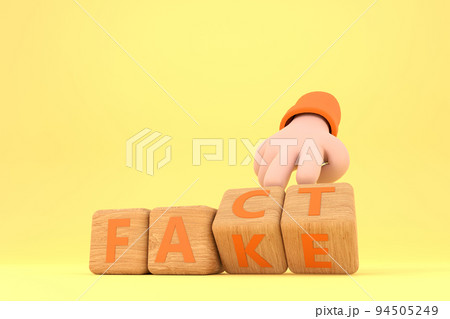 Hand turns dice and changes the word "fake" to "fact". 94505249