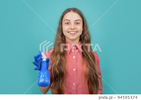 cheerful kid in rubber gloves with spray bottle on blue background 94505374