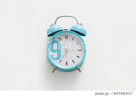 Blue alarm clock on the white background. Morning, time to wake up. 94506937