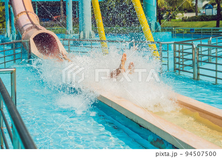 Man having fun at water park. 94507500