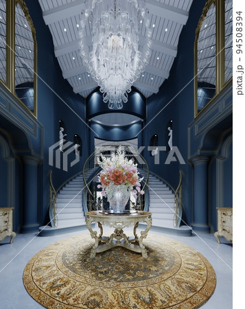 Foyer entrance hall with a carved table with a bouquet in the center with a large crystal chandelier in a classic interior with dark blue walls. 94508394
