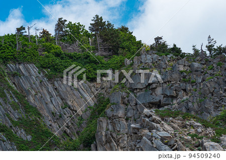 coastal landscape, beautiful wooded rocks formed by columnar basalt 94509240