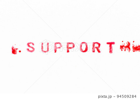 Red color ink rubber stamp in word support on white paper background 94509284