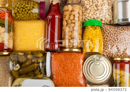 Emergency survival groceries on kitchen table closeup flat lay 94509372