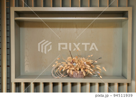dried exotic flower Protea and shadow on beige paint textured background close up . poster. minimal floral concept. dried exotic flower Protea and shadow on beige paint textured background close up . poster. minimal floral concept. 94511939