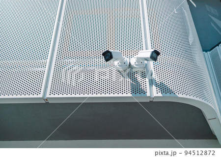 Close up of CCTV camera over defocused background with copy space 94512872