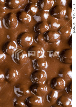 real milk chocolate while cooking with hazelnuts real milk chocolate while cooking with hazelnuts 94515701