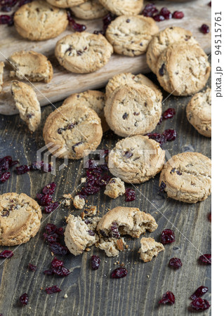 delicious dried cookies made of high-quality flour with dried red cranberries on the table 94515761