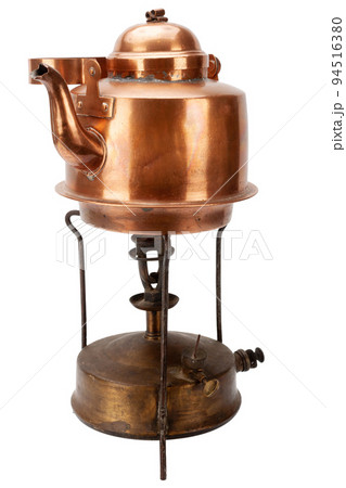 Retro vintage bronze primus stove with copper teapot. 94516380