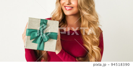 Birthday, Christmas or holiday present, happy woman holding a green gift or luxury beauty box subscription delivery isolated on white background, portrait 94518390