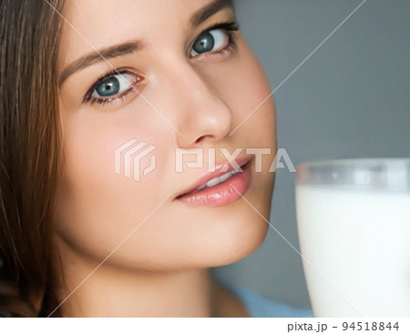 Diet and wellness, young woman with glass of milk or protein shake cocktail, portrait Diet and wellness, young woman with glass of milk or protein shake cocktail, portrait 94518844