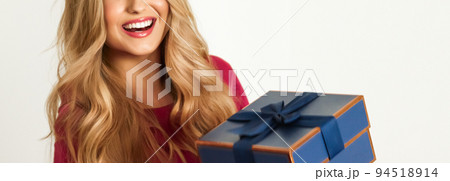 Birthday, Christmas or holiday present, happy woman holding a green gift or luxury beauty box subscription delivery isolated on white background, portrait Birthday, Christmas or holiday present, happy woman holding a green gift or luxury beauty box subscription delivery isolated on white background, portrait 94518914