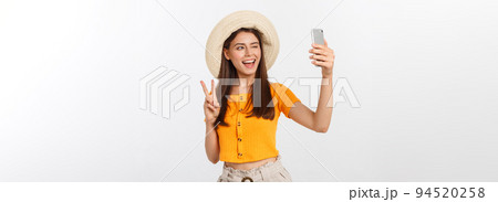 Young Caucasian woman enjoying the selfie with herself isolated on white background summer travel concept. 94520258