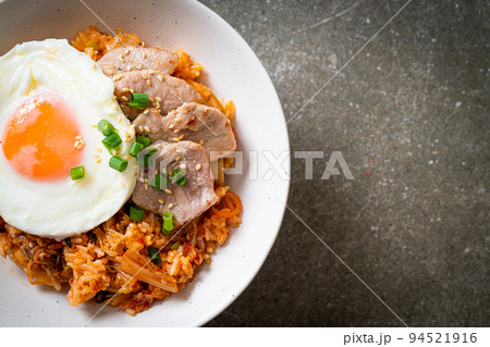 Kimchi fried rice with fried egg and pork Kimchi fried rice with fried egg and pork 94521916