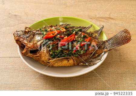 Fried Tilapia Fish with Basil chili garlic sauce 94522335