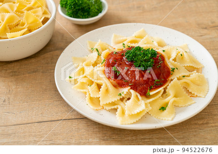 farfalle pasta in tomato sauce with parsley farfalle pasta in tomato sauce with parsley 94522676