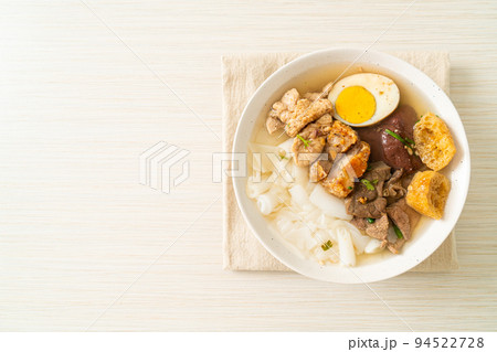 paste of rice flour or boiled Chinese pasta square in clear soup 94522728