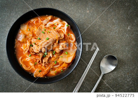 Korean udon ramen noodles with pork in kimchi soup Korean udon ramen noodles with pork in kimchi soup 94522775