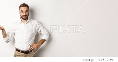 Confused office worker shrugging, cant understand something, standing over white background Confused office worker shrugging, cant understand something, standing over white background 94522941