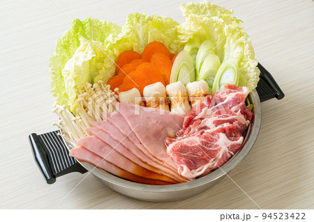 sukiyaki or shabu hot pot black soup with meat raw and vegetable sukiyaki or shabu hot pot black soup with meat raw and vegetable 94523422
