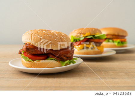 grilled chicken burger with sauce on plate grilled chicken burger with sauce on plate 94523638