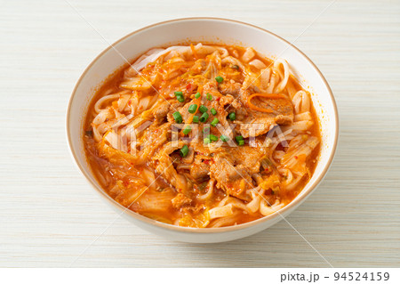 Korean udon ramen noodles with pork in kimchi soup 94524159