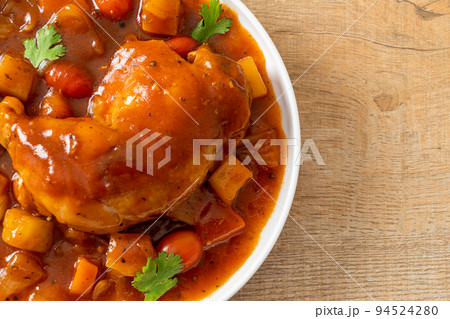 chicken stew with tomatoes, onions, carrot and potatoes 94524280