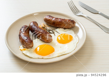 double fried egg with pork sausage 94524296
