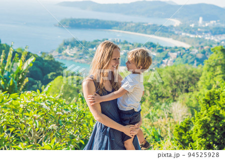 Mom and son on Karon View Point in sunny day. Phuket Mom and son on Karon View Point in sunny day. Phuket 94525928