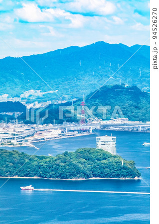 広島市街地を瀬戸内海の島の山頂から展望しています。元宇品公園やG7会場のホテルが見えます。広島県 94526270