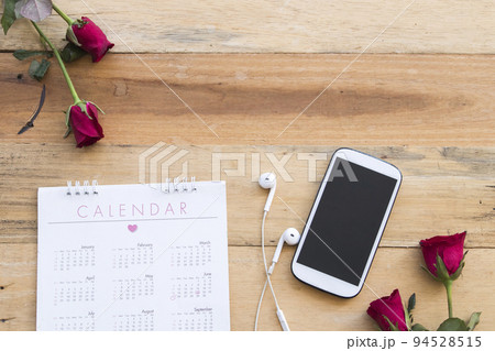mobile phone with calendar planner for business work arrangement flat lay style mobile phone with calendar planner for business work arrangement flat lay style 94528515