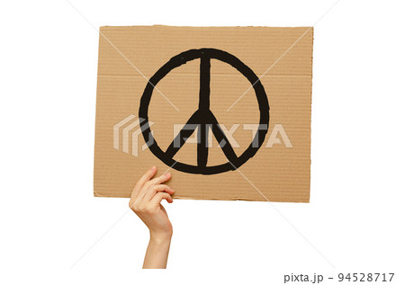 Poster against the war made of cardboard in hand. International day of Peace. Isolated on a white background Poster against the war made of cardboard in hand. International day of Peace. Isolated on a white background 94528717