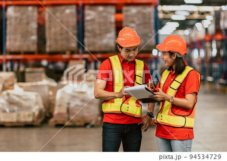 warehouse worker working together happy smile work checking inventory stock order for shipping. warehouse worker working together happy smile work checking inventory stock order for shipping. 94534729