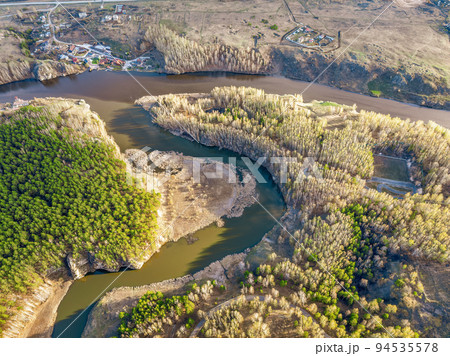 Confluence of the Iset and Kamenka rivers in the city Kamensk-Uralskiy. Iset and Kamenka rivers, Kamensk-Uralskiy, Sverdlovsk region, Ural mountains, Russia. Aerial view Confluence of the Iset and Kamenka rivers in the city Kamensk-Uralskiy. Iset and Kamenka rivers, Kamensk-Uralskiy, Sverdlovsk region, Ural mountains, Russia. Aerial view 94535578