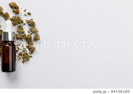 Image of bottle of cbd oil on white surface Image of bottle of cbd oil on white surface 94536160