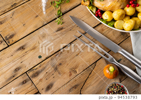 Overhead view of thanksgiving table with roast turkey, potatoes and copy space on wood 94538793