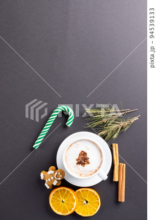 Image of cup of cappuccino coffee and christmas gingerbread man with copy space on grey Image of cup of cappuccino coffee and christmas gingerbread man with copy space on grey 94539133