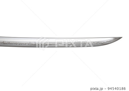 Japanese sword blade (made in China) on white background. Soft focus. The wavy pattern on the blade edge is a line of hardness that a blacksmith makes so that the blade doesn't break. Japanese sword blade (made in China) on white background. Soft focus. The wavy pattern on the blade edge is a line of hardness that a blacksmith makes so that the blade doesn't break. 94540186