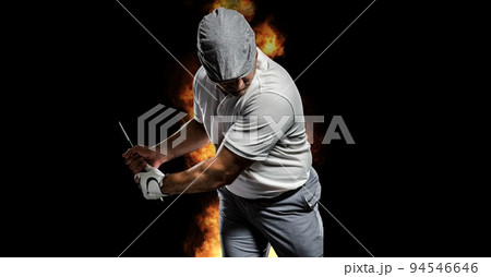 Composition of male golf player over flames on black background 94546646