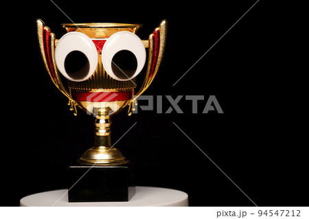 image of gold cup dark background  94547212