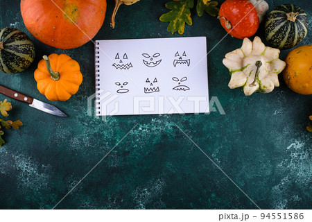 Notebook with scary face for making Halloween jack-o-lantern 94551586
